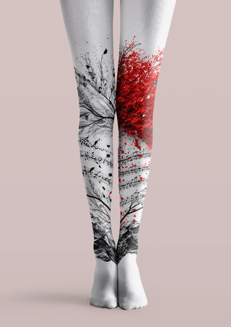 White printed tights with black branches, musical notes, a red tree motif, and a monochrome landscape.