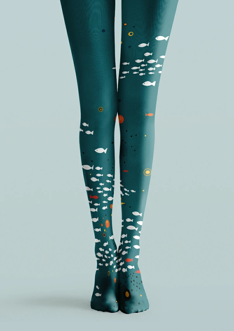 Blue printed tights with groups of white fish, small orange fish, yellow rings and scattered dark dots.