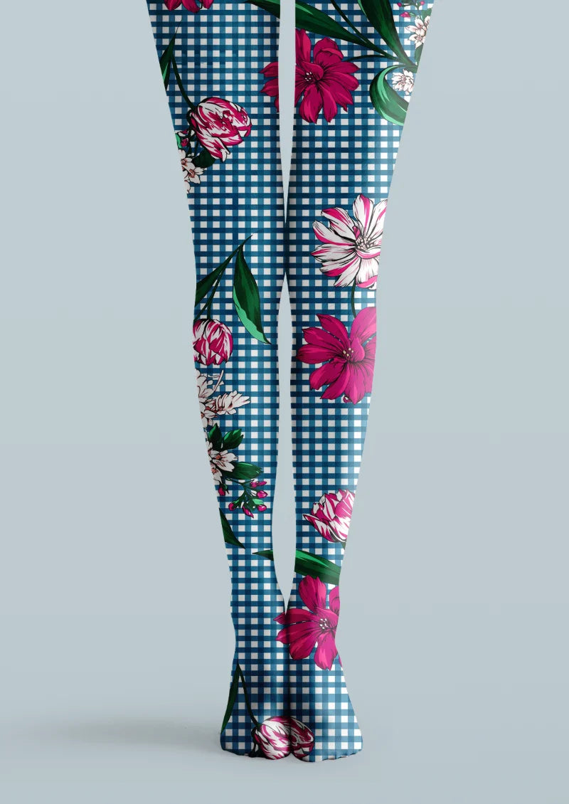 Blue and white printed tights with pink floral motifs, green leaves, and repeating gingham plaid across both legs