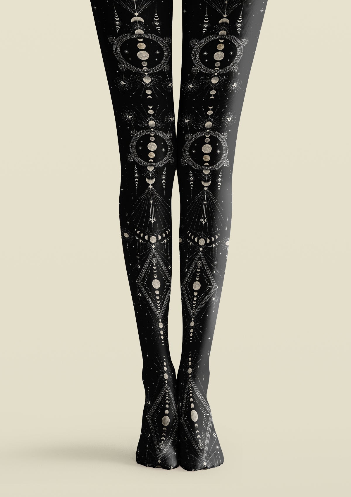 Black printed tights with gray moon phases, stars, celestial frames, and fine radiating linework.