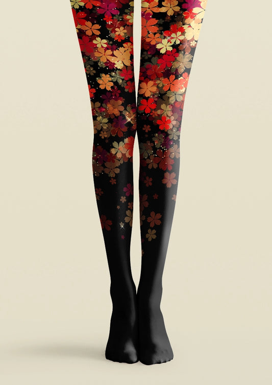 Black printed tights with layered red, orange, pink, and brown floral pattern cascading down the legs