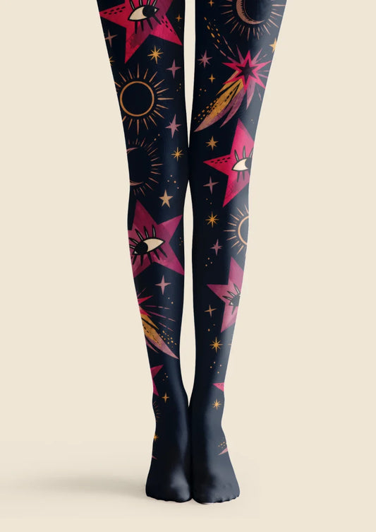 Black tights with pink eye-centered stars, crescent moons, bronze sun outlines and sweeping comet motifs