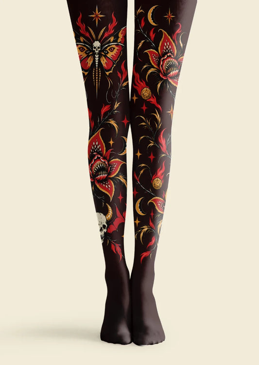 Black tights with red and orange skull moth, toothed flower, crescent moon, star, and botanical motifs