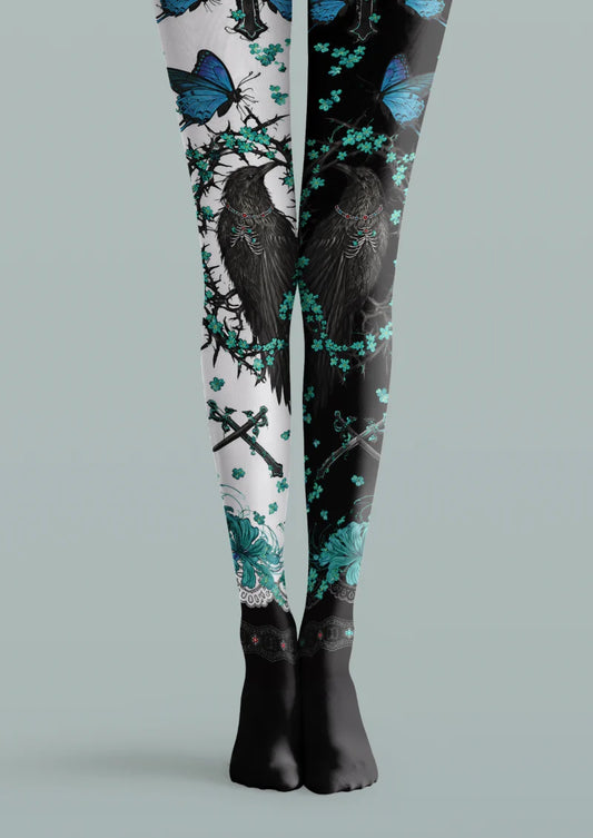 Black and white printed tights with black ravens, blue butterflies, turquoise flowers, crossed swords and black feet.
