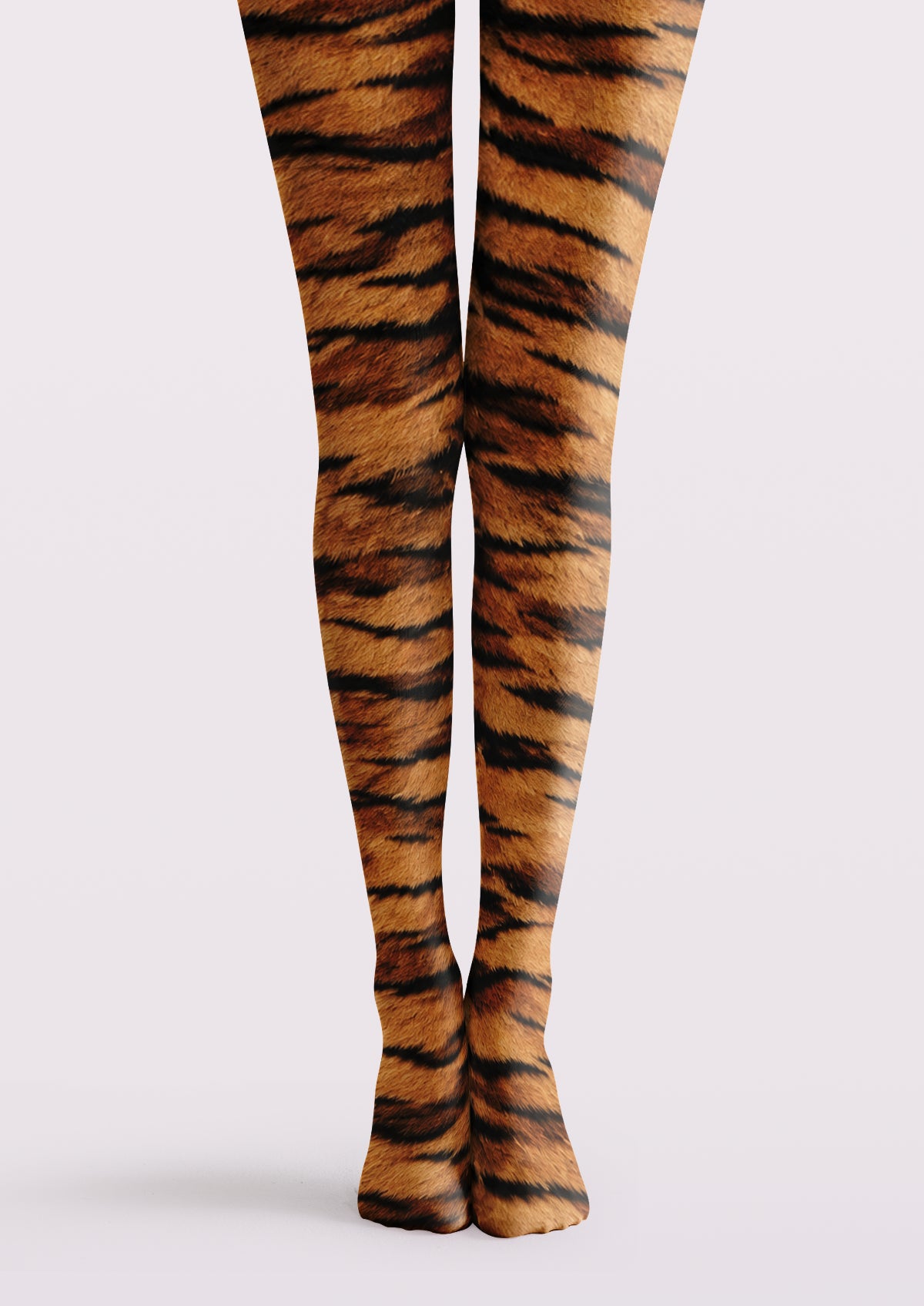 Brown printed tights with black tiger stripes and a warm orange-brown animal pattern across both legs.