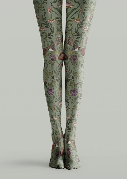 Green printed tights with brown flying birds, curling foliage, pink blossoms and purple flower details.