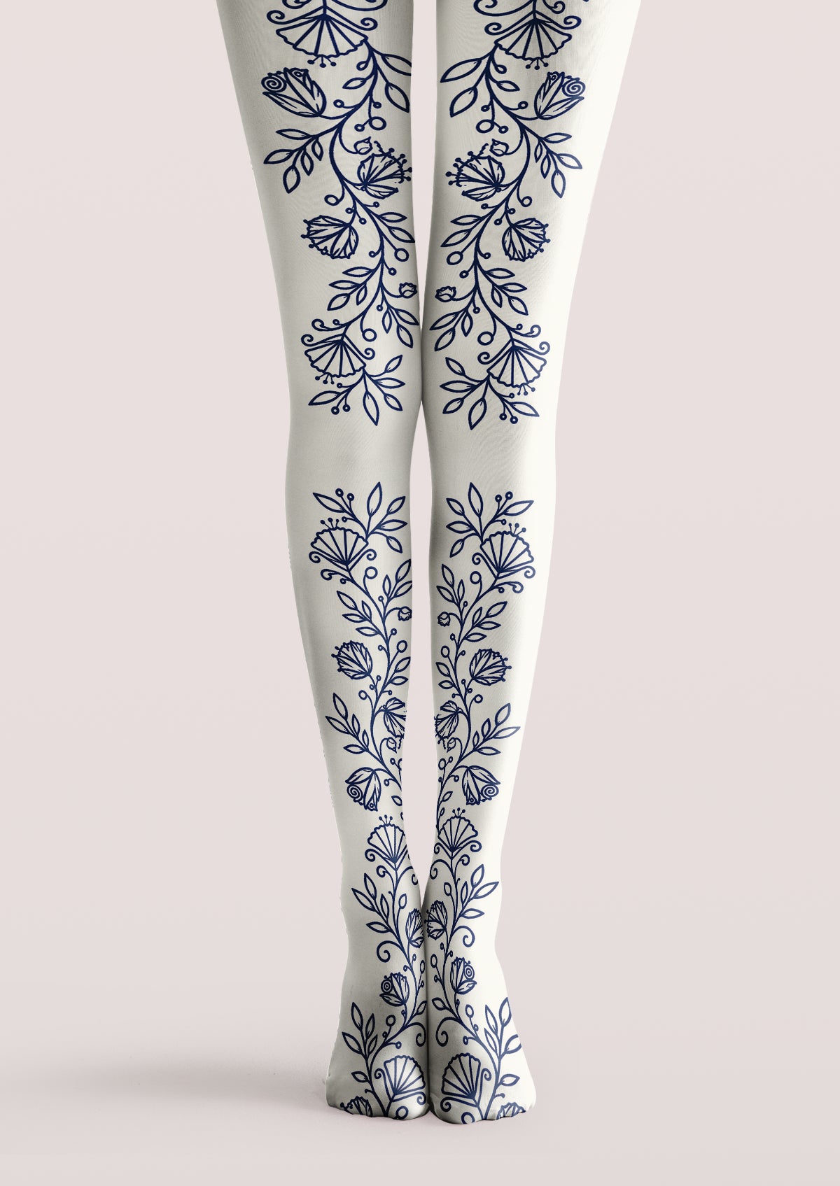 Ivory printed tights with navy floral vines, leaves, buds, and stylized flowers arranged vertically along both legs.