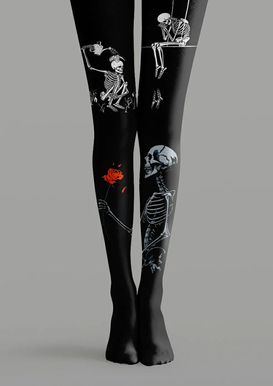 Black printed tights with white and gray skeletons, a red rose, a watering can and a skeleton seated on a swing.