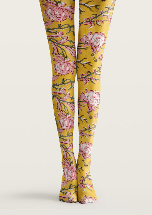 Yellow printed tights with pink floral motifs, green branches, leaves, and botanical patterns across both legs.