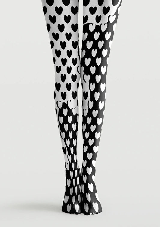 Black and white printed tights with repeating hearts, reversed colours and curved boundaries between light and dark areas.