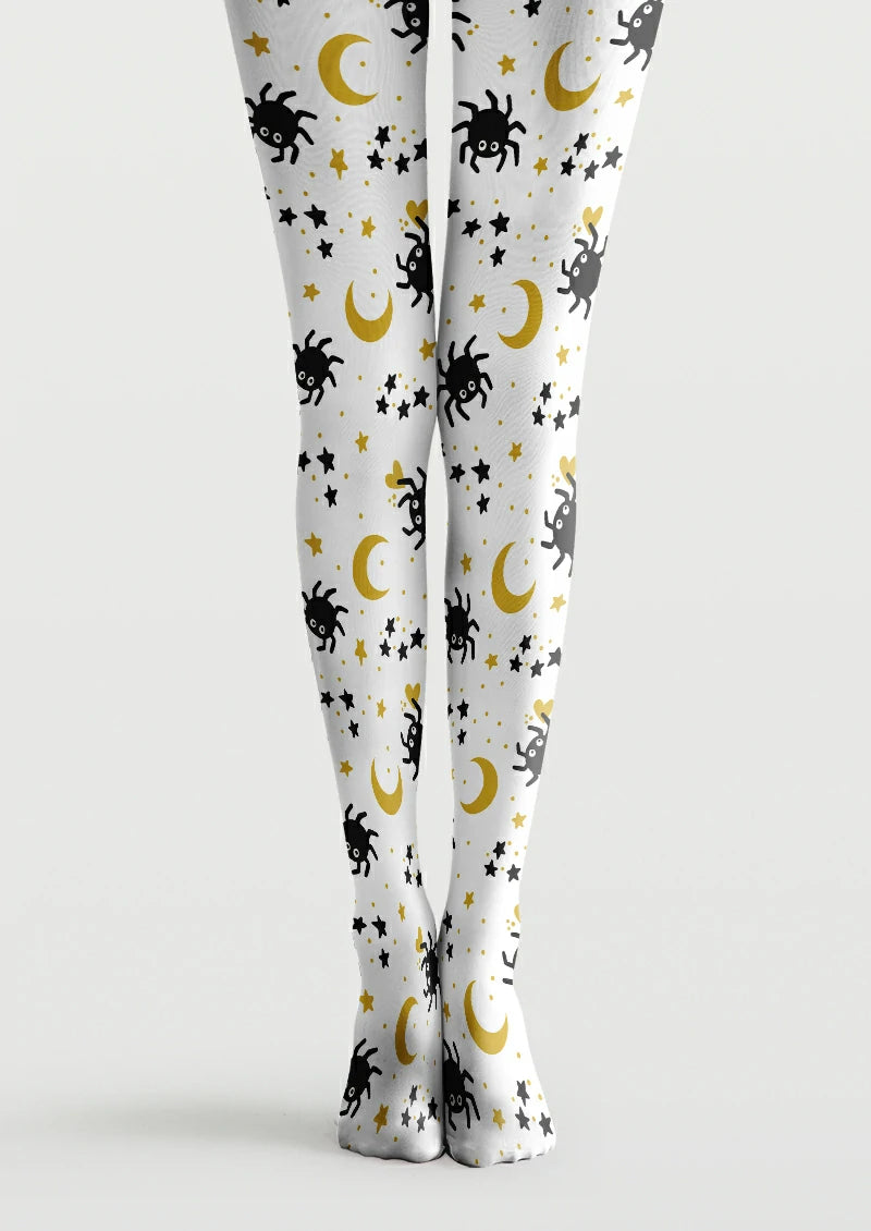 White printed tights with black cartoon spiders, yellow crescent moons, scattered stars, small hearts and dots