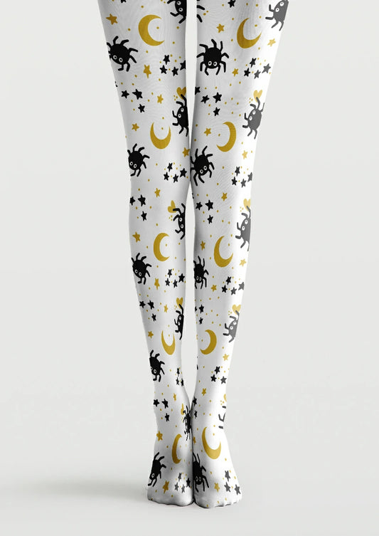 White printed tights with black cartoon spiders, yellow crescent moons, scattered stars, small hearts and dots