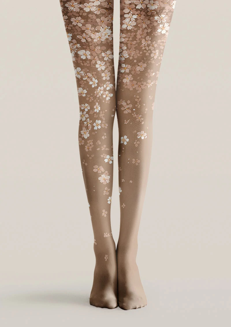 Beige printed tights with scattered white and blush pink blossom pattern