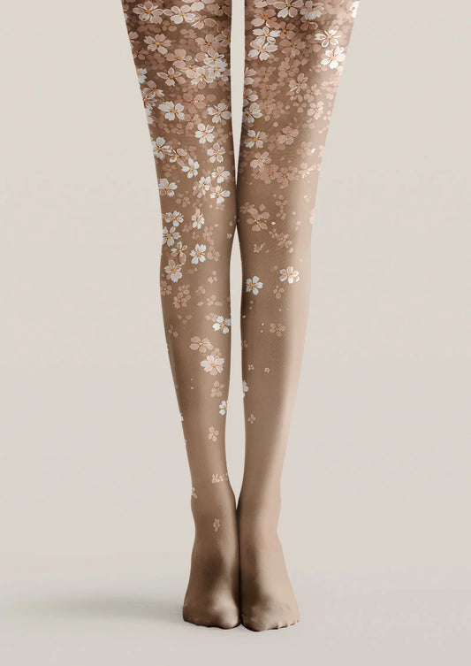 Beige printed tights with scattered white and blush pink blossom pattern