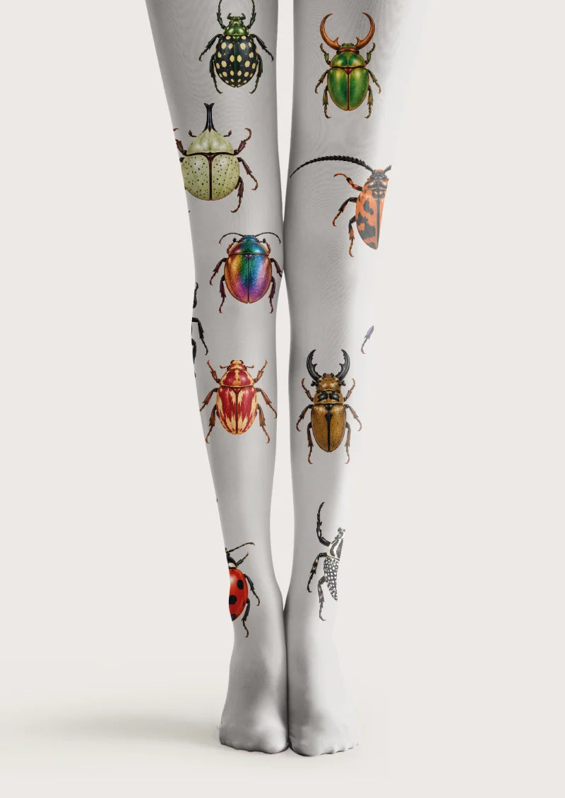 White tights with individually spaced colorful beetle illustrations, spotted shells, curved horns, and fine antennae.