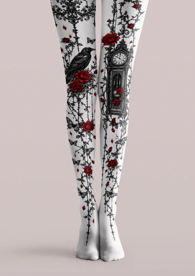White printed tights with red roses, black vines, butterflies, a raven and an ornate clock.
