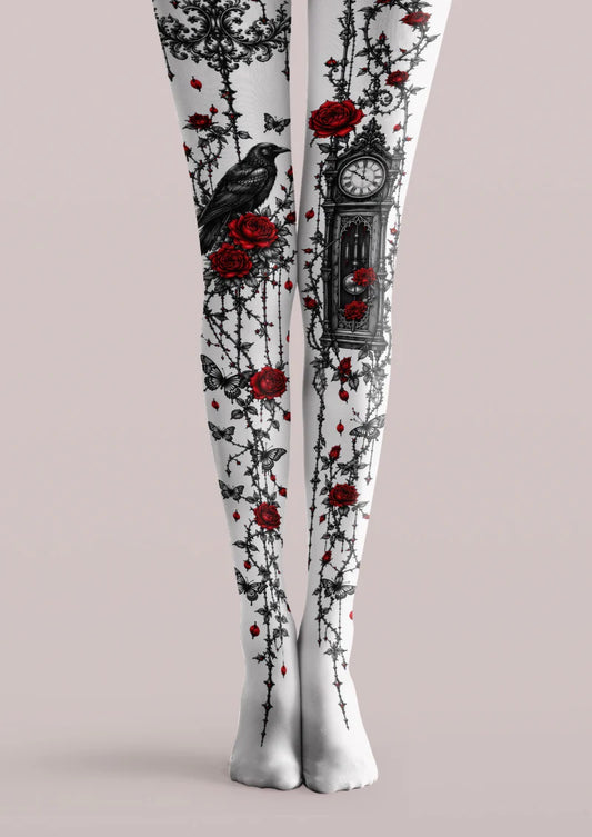 White printed tights with red roses, black vines, butterflies, a raven and an ornate clock.