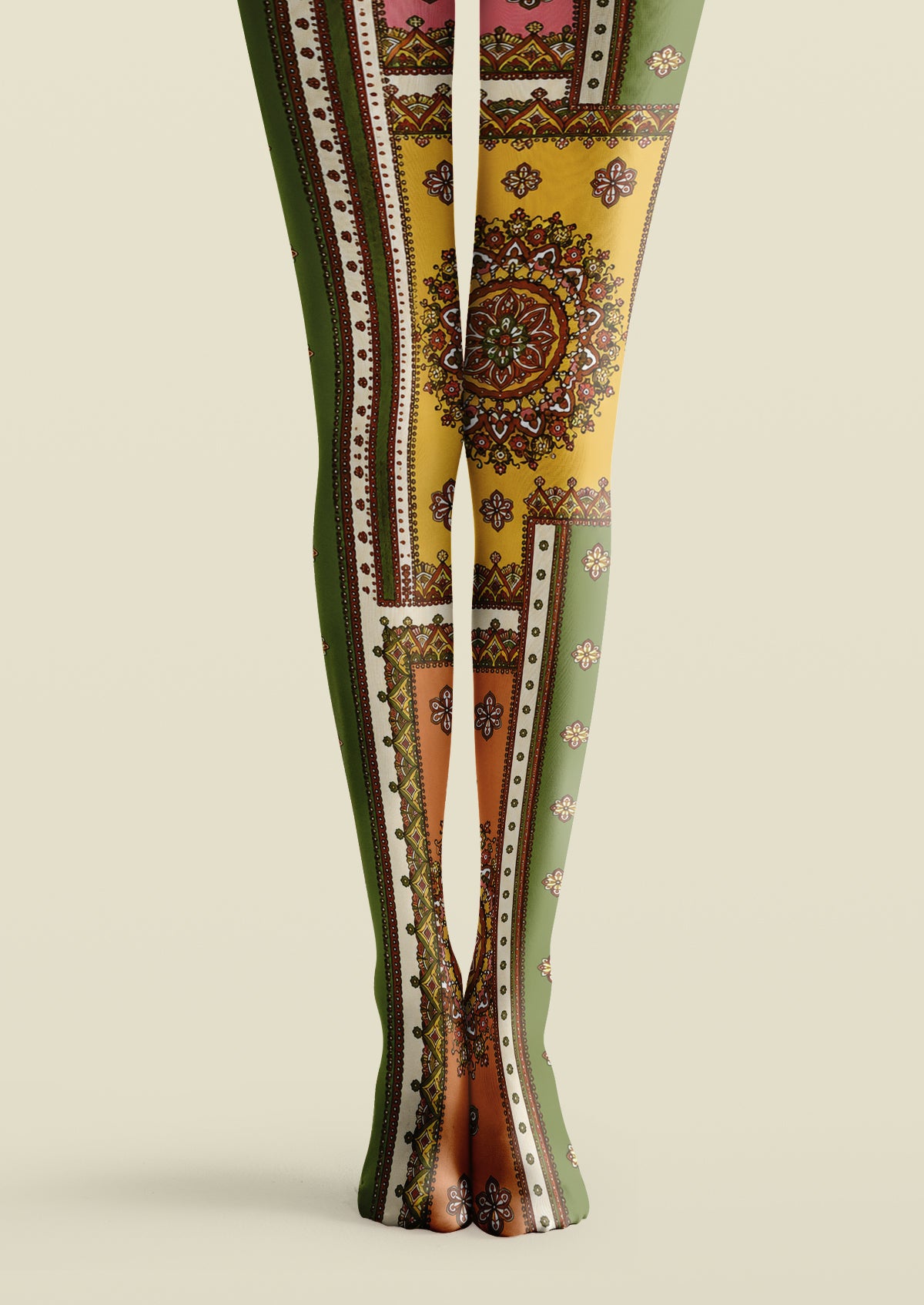 Green printed tights with ornate mandala medallions, decorative borders, and small floral motifs in yellow and brown.