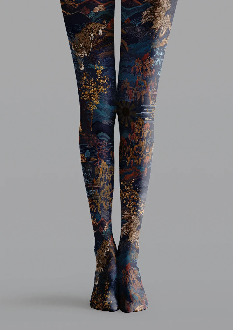 Navy printed tights with brown tigers and eagles, blue mountains, trees, water and small buildings.