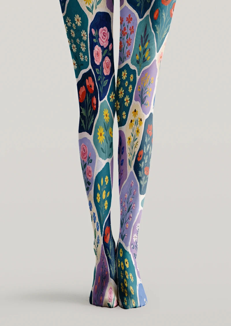 Blue and purple printed tights with ivory borders framing pink roses, yellow daisies and orange flowers