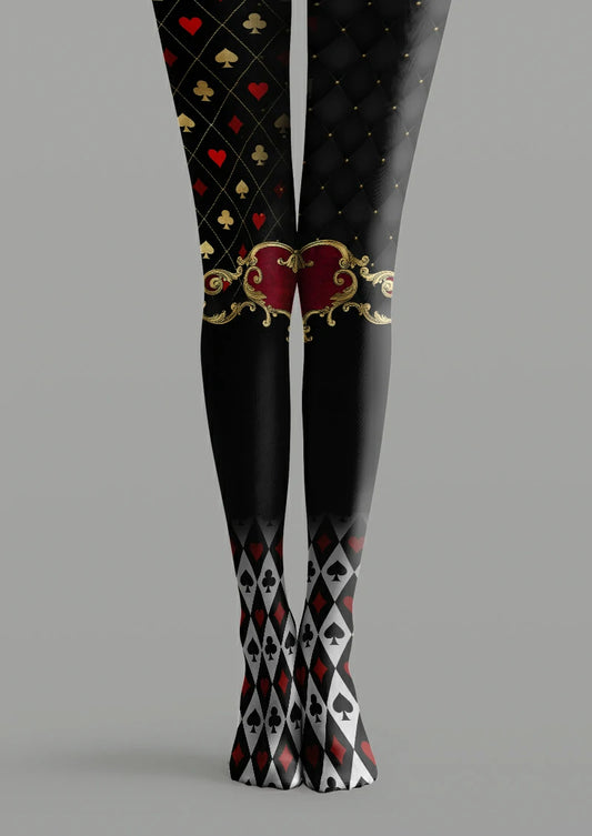 Black printed tights with playing card suits, red hearts, ornate scrollwork and white diamond patterns