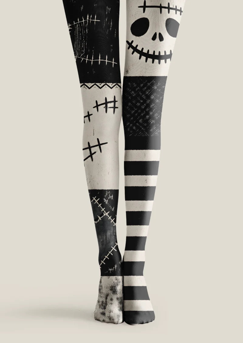 Black tights with ivory skull graphics, stitch motifs, distressed patchwork panels and horizontal stripes.