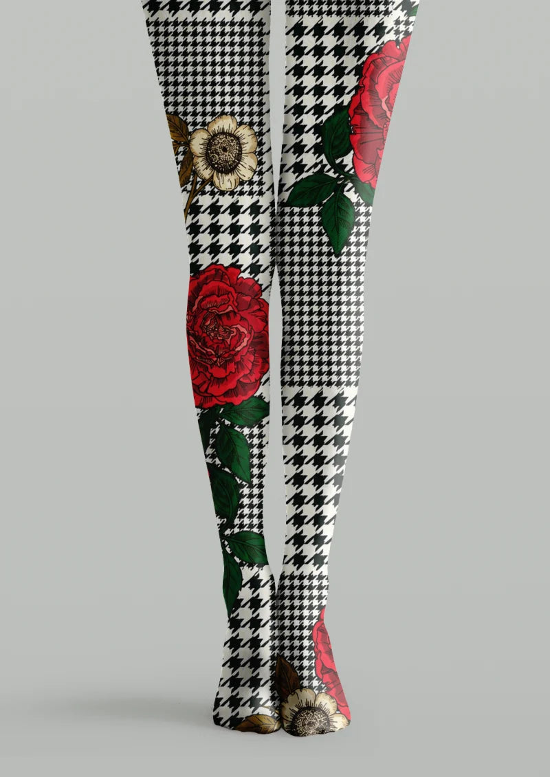 White printed tights with black houndstooth checks, red floral motifs, green leaves, and light floral accents