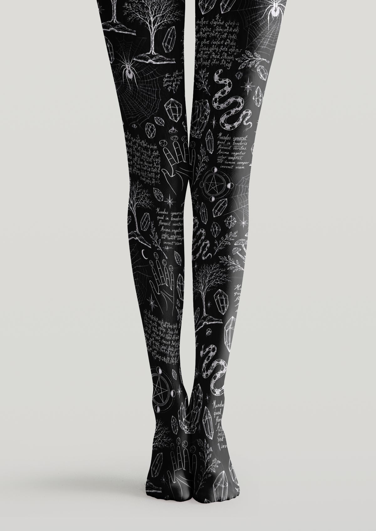 Black printed tights with snakes, crystals, spider webs, mystical hands, stars, and occult symbols