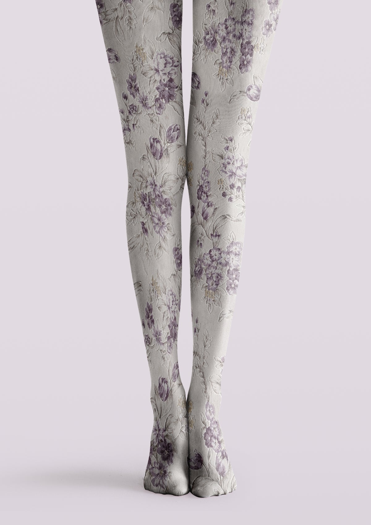 Ivory printed tights with muted lavender flowers, buds, and delicate botanical leaves across both legs