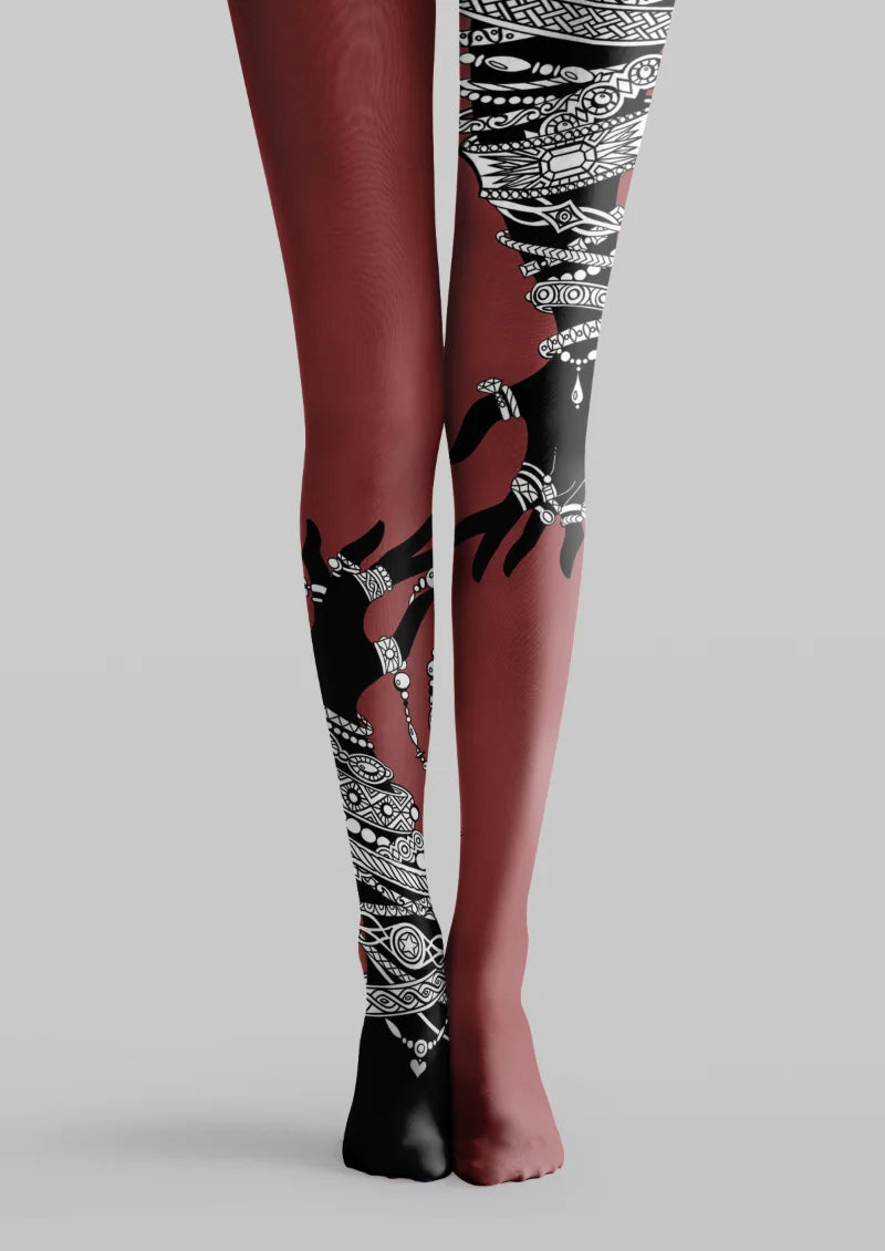 Burgundy printed tights with black and white jeweled female silhouette illustration across the legs