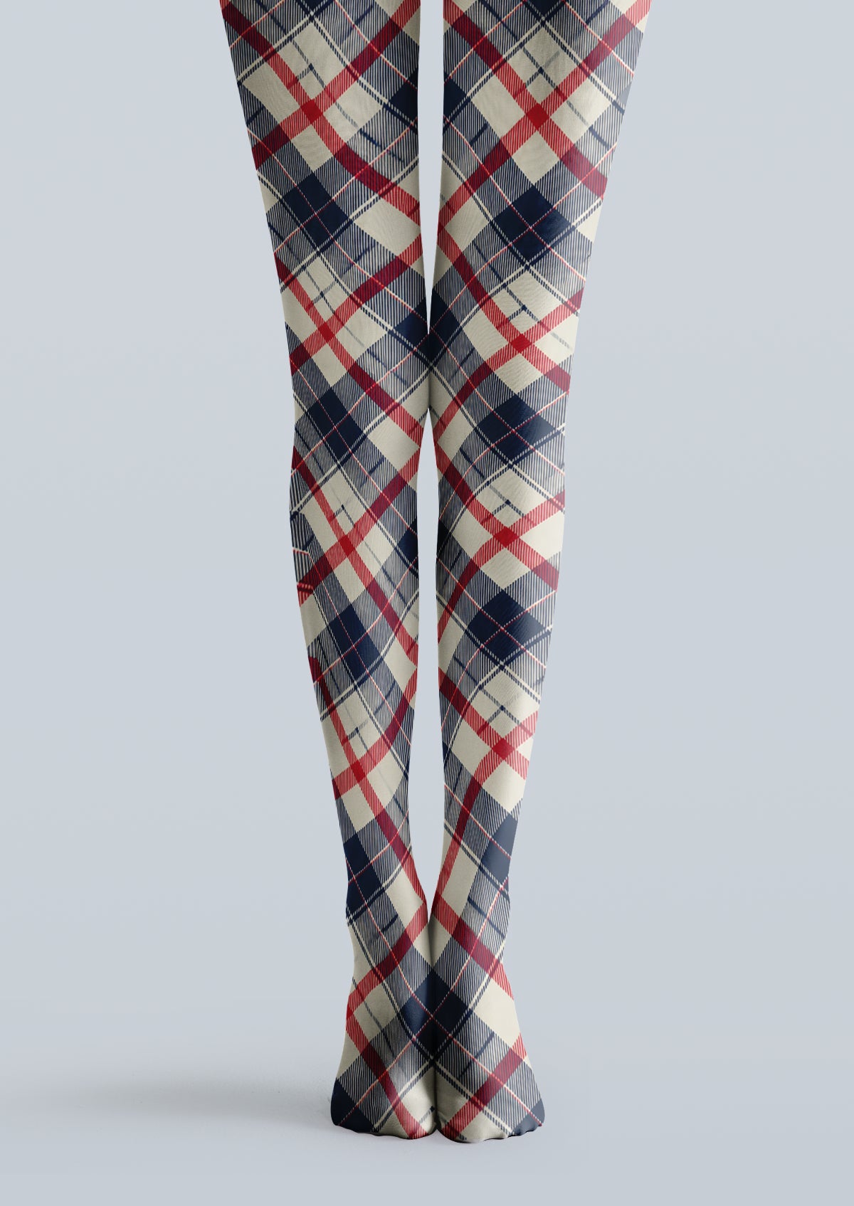 Ivory printed tights with navy and red tartan plaid checks across both legs