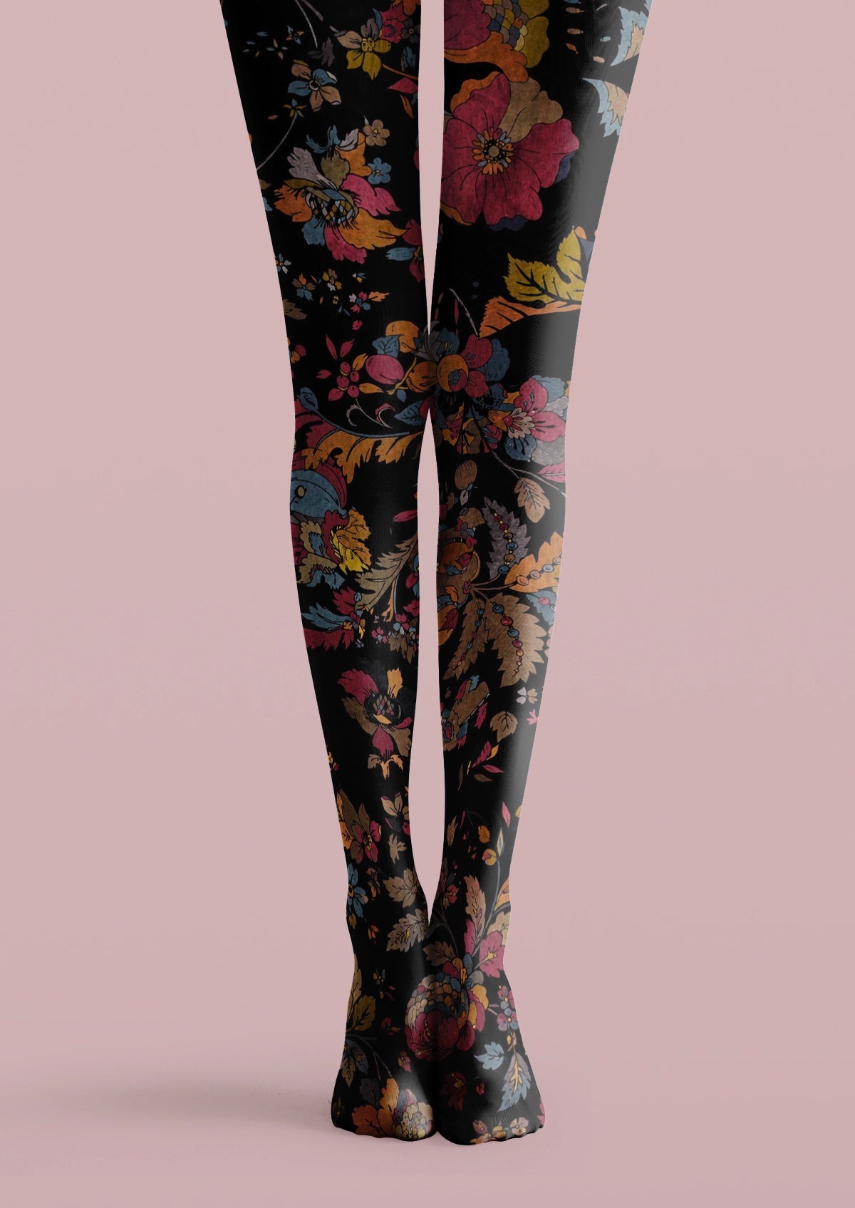 Black printed tights with pink flowers, yellow leaves, blue accents, and layered vintage floral details