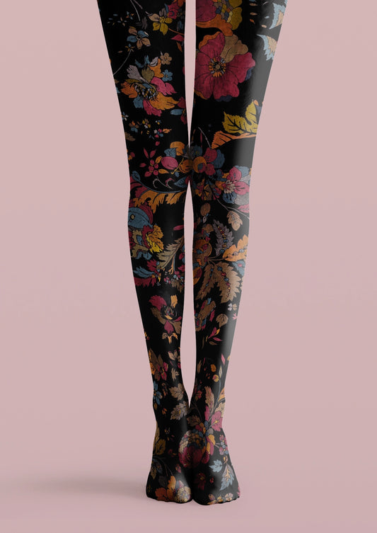 Black printed tights with pink flowers, yellow leaves, blue accents, and layered vintage floral details