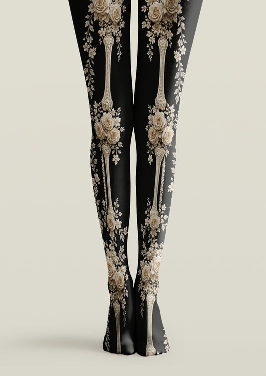 Black printed tights with ivory roses, floral bouquets, and antique decorative motifs across both legs