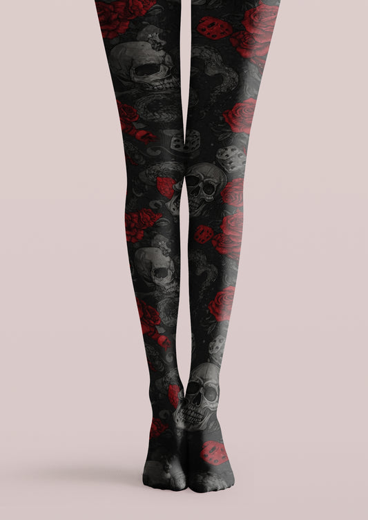 Black printed tights with gray skulls, red roses, dice, snake details, and gothic tattoo motifs