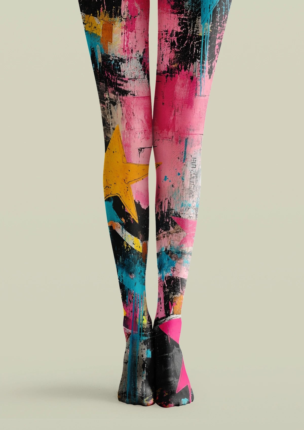 Pink printed tights with abstract graffiti paint strokes, geometric blocks, stars, and colorful distressed textures