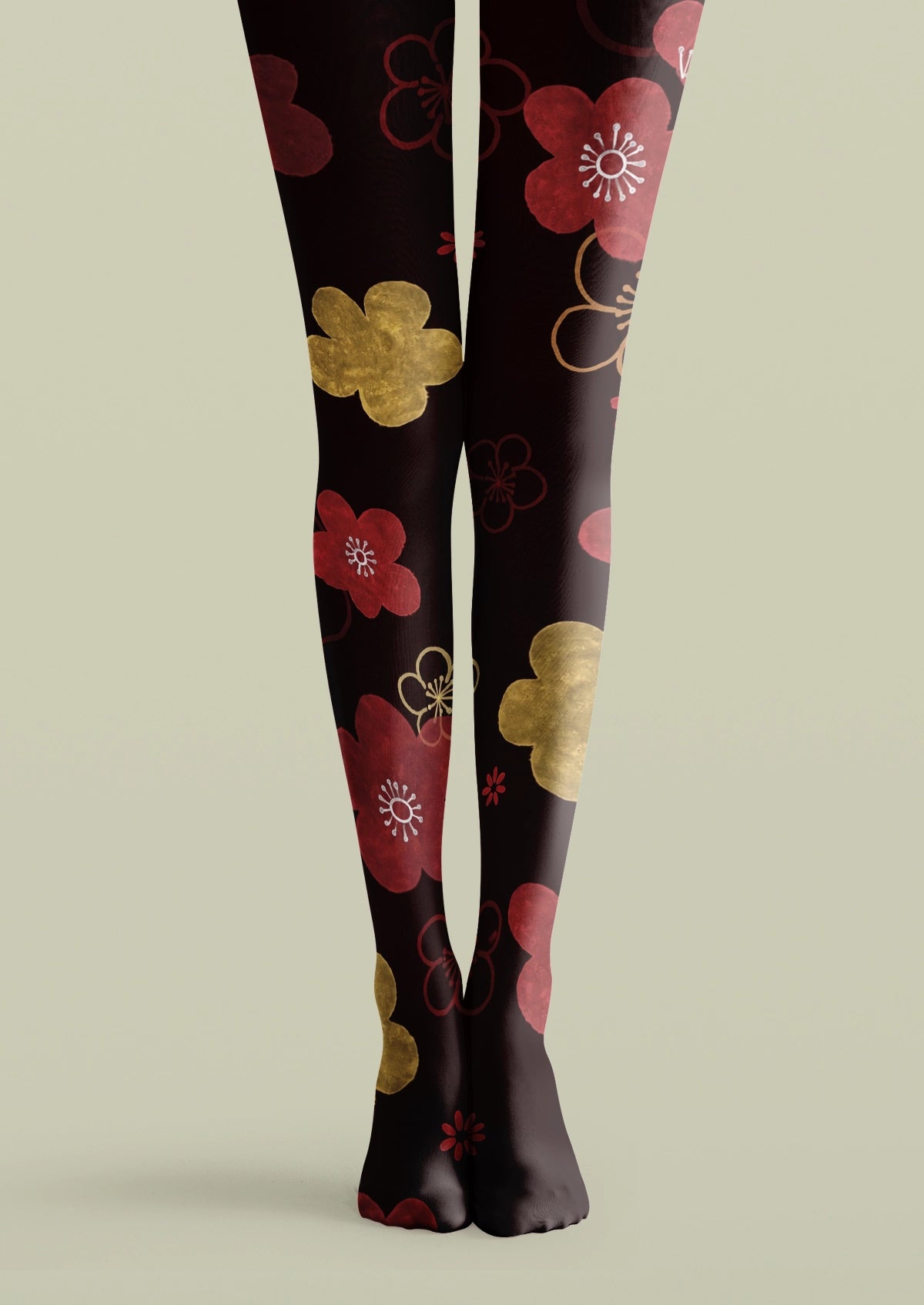 Black printed tights with red pink blossoms, gold floral accents, and minimalist botanical patterns