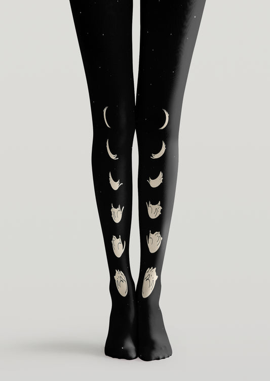 Black printed tights with ivory moon phases arranged vertically across both legs and subtle star accents