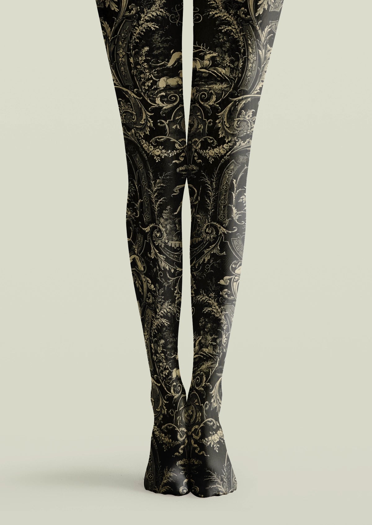Black printed tights with beige baroque scrollwork, deer, floral garlands, and framed woodland scenes