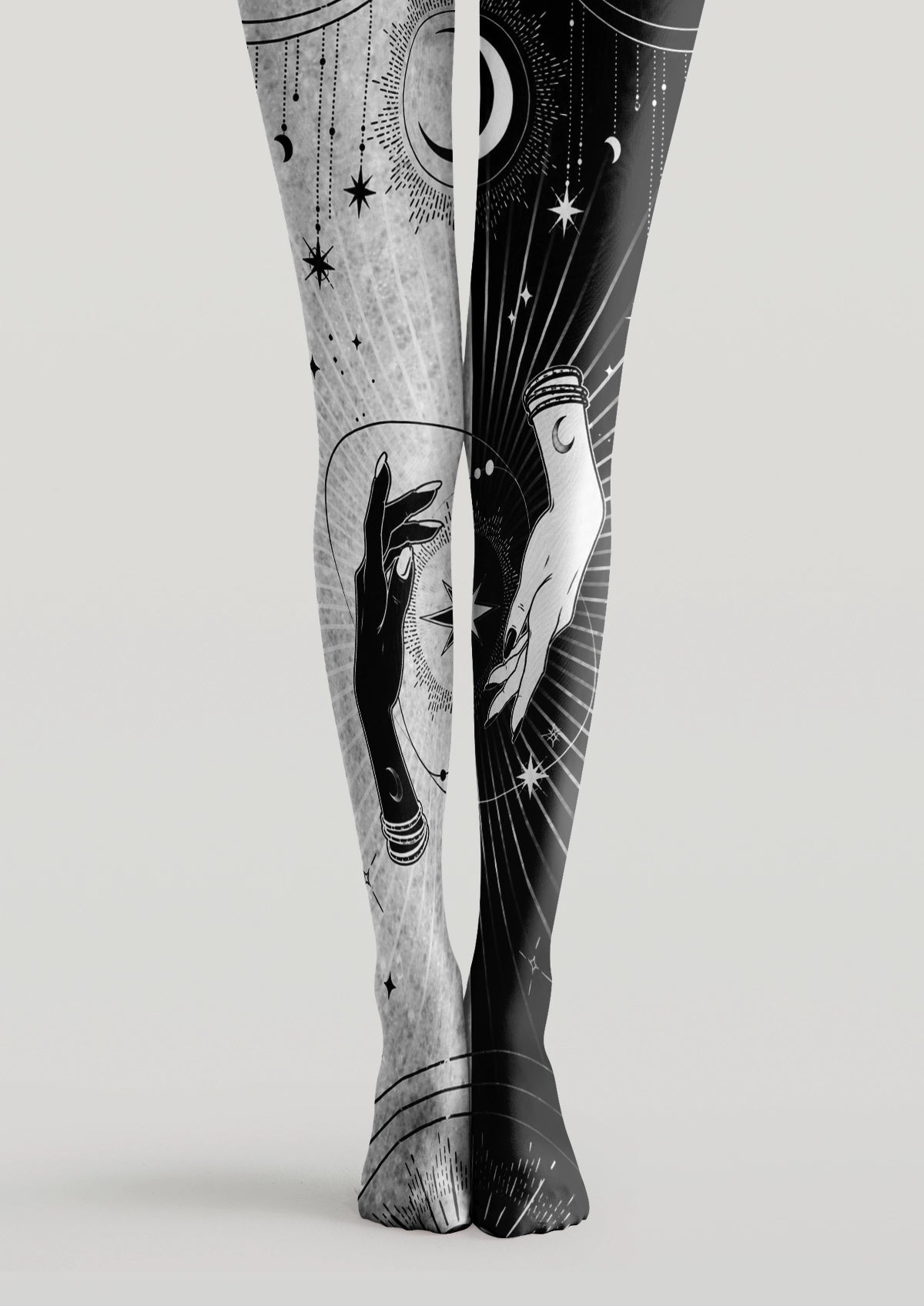Black and white printed tights with mystical hands, crescent moons, stars, and celestial linework