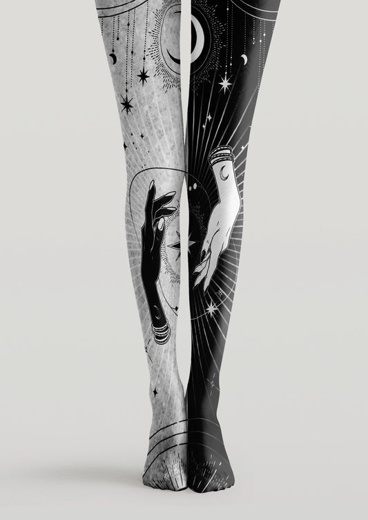 Black and white printed tights with mystical hands, crescent moons, stars, and celestial linework