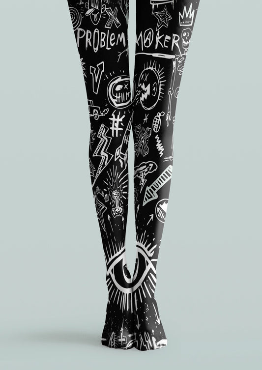 Black printed tights with white eye, skull, lightning, star, crown, and hand-drawn graffiti motifs