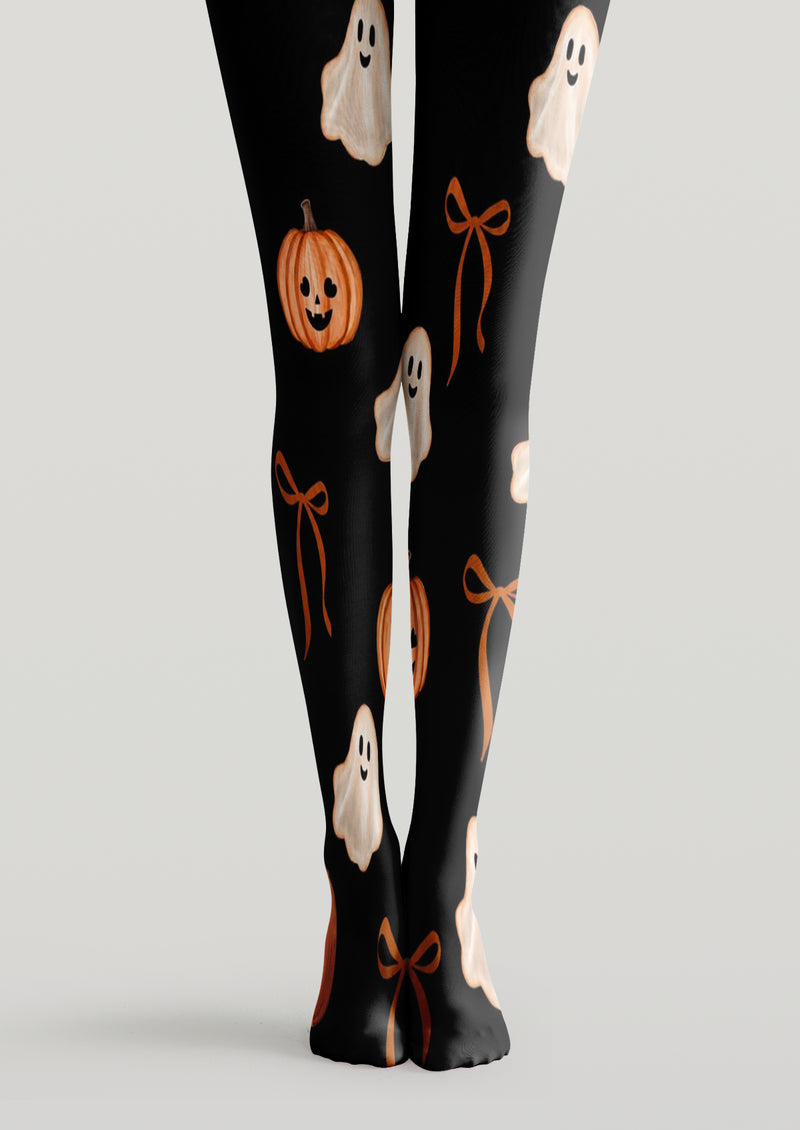 Black printed tights with smiling ghosts, pumpkins, and ribbon bows across both legs