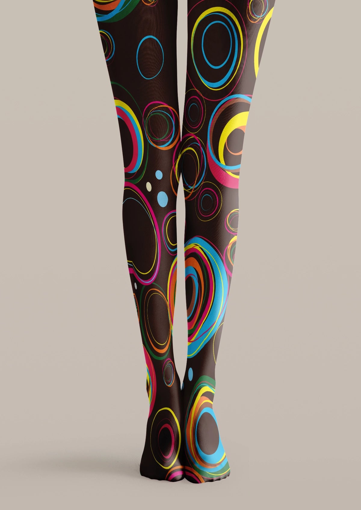Black printed tights with colorful geometric circles, concentric rings, and abstract graphic patterns