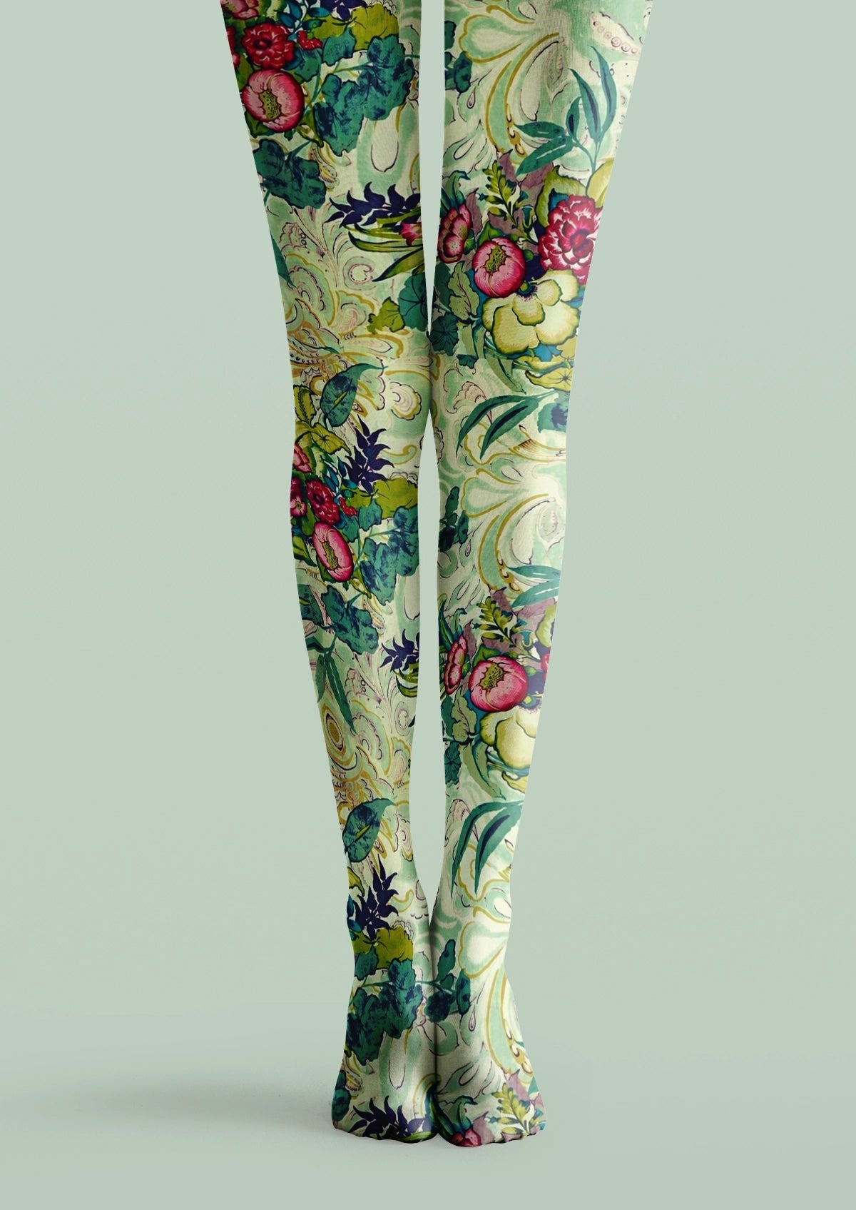 Green printed tights with pink flowers, leafy branches, curling vines, and ornate botanical details