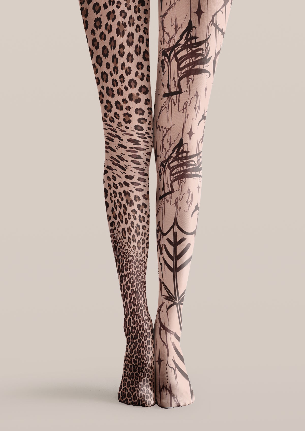 Beige printed tights with leopard spots on one leg and black graffiti-style artwork on the other
