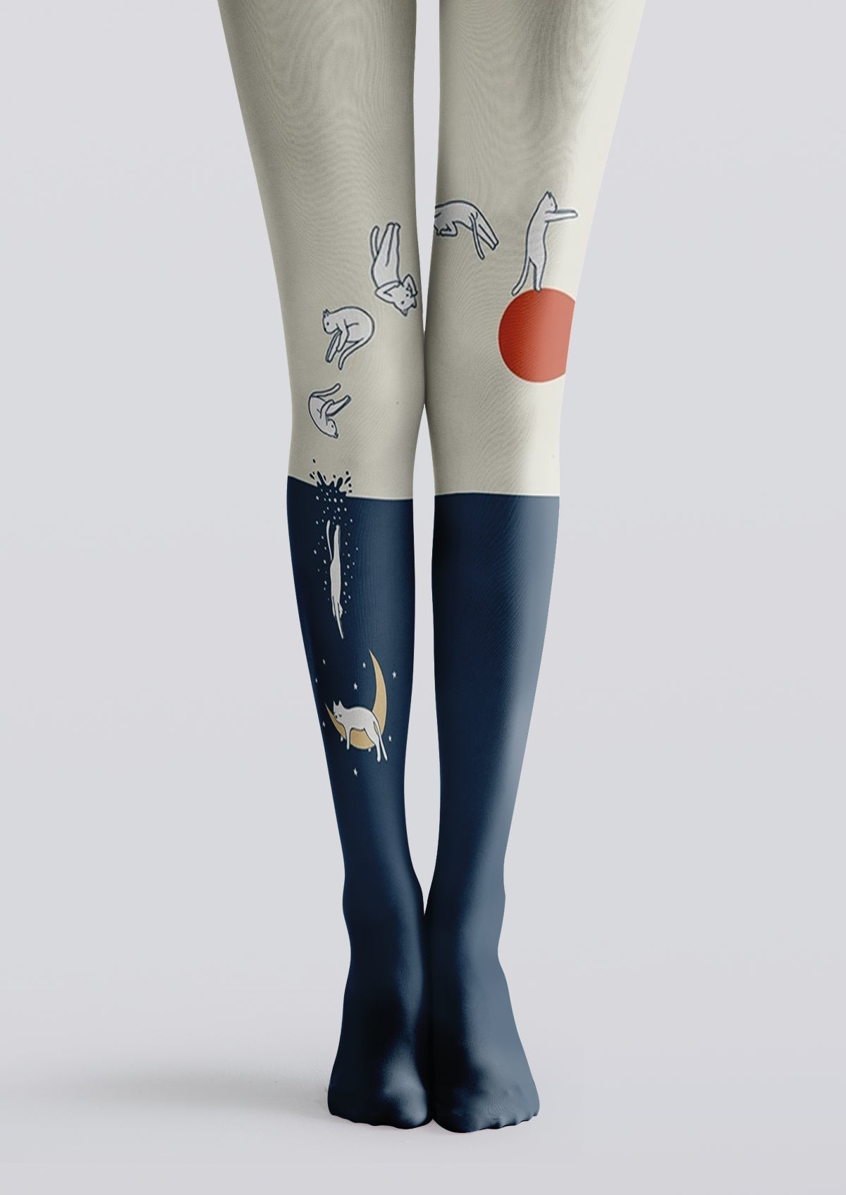 Ivory and navy printed tights with cats, orange sun, crescent moon, stars, and shooting-star details