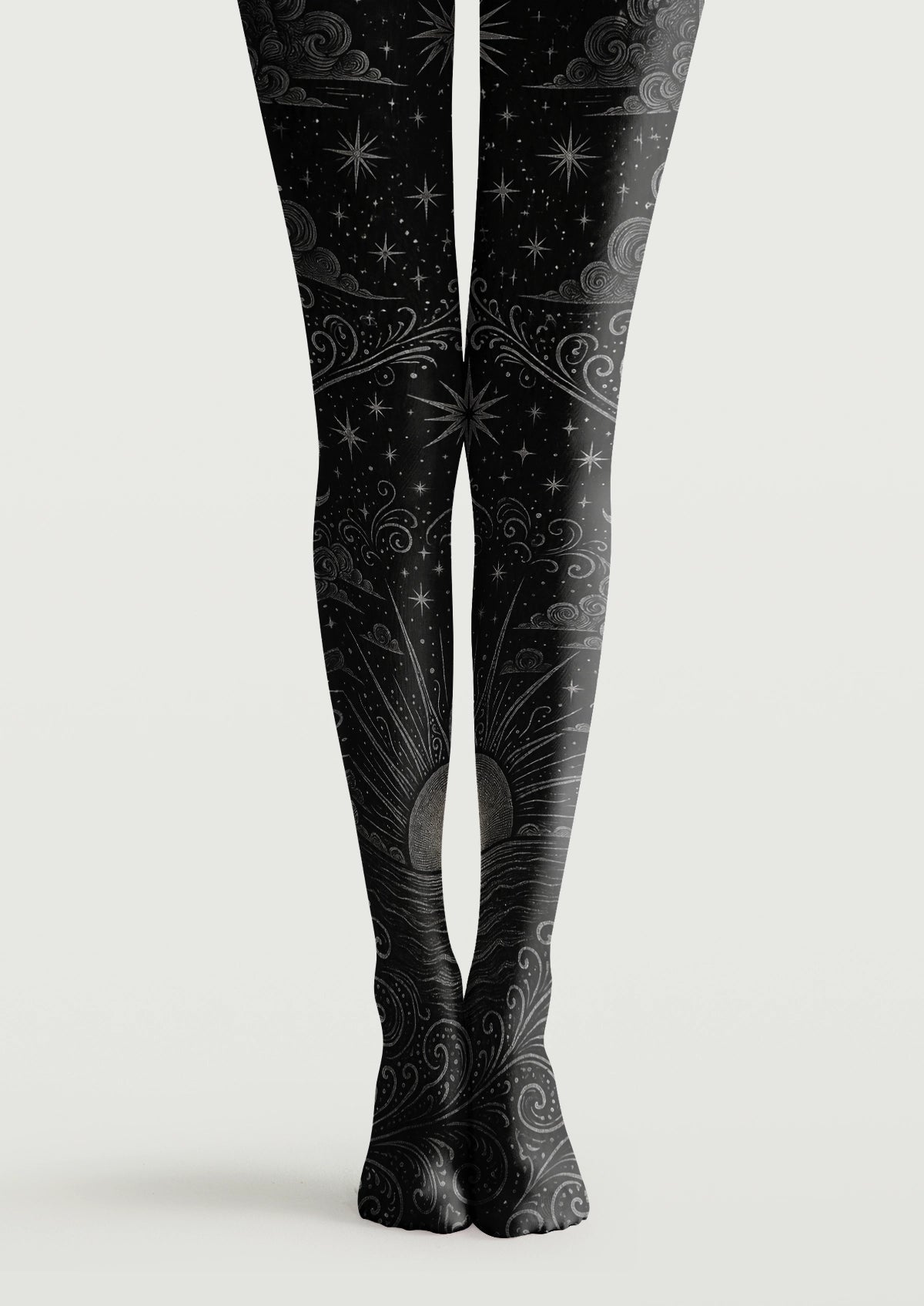 Black printed tights with gray stars, swirling clouds, ornamental lines, and a rising sun motif