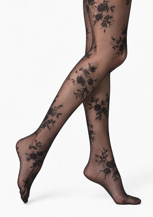 Black printed tights with scattered rose bouquets and delicate lace-effect floral details across the legs and feet