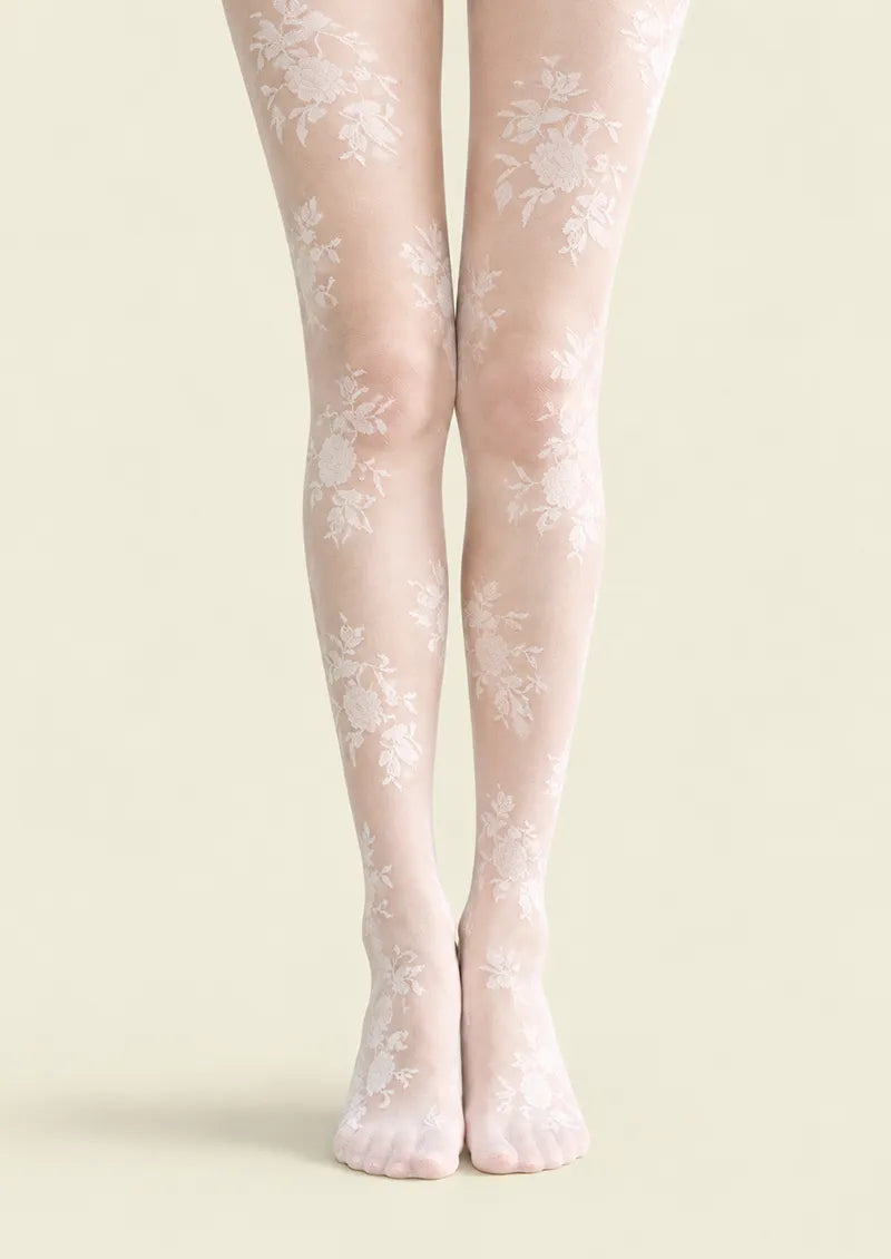 White printed tights with scattered rose bouquets and delicate lace-effect floral details along the legs and feet